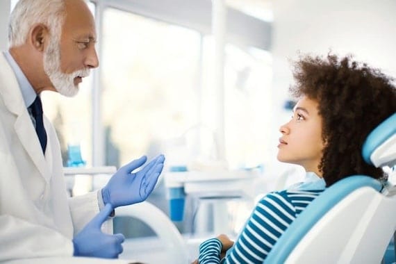 dr. discussing treatment with patient